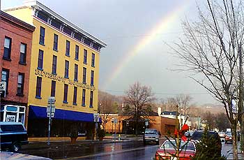 A street in Owego, New York, under a rainbow